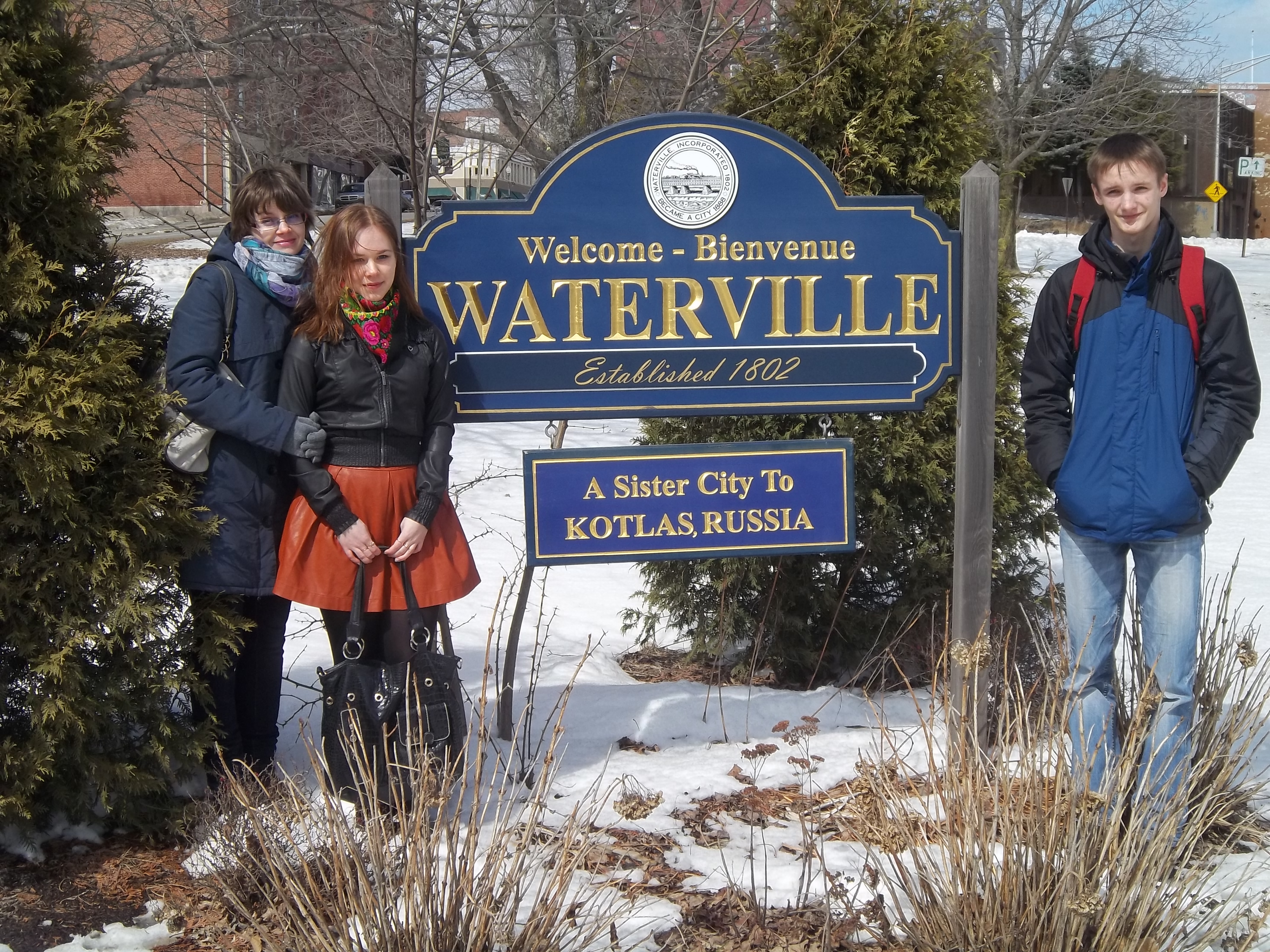 Students around Sister City sign