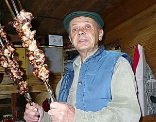 Yuri Tushin holds the shashliki.