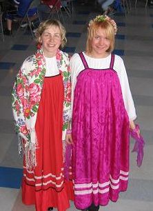 Nadya and Dasha in colorful Russian dresses.